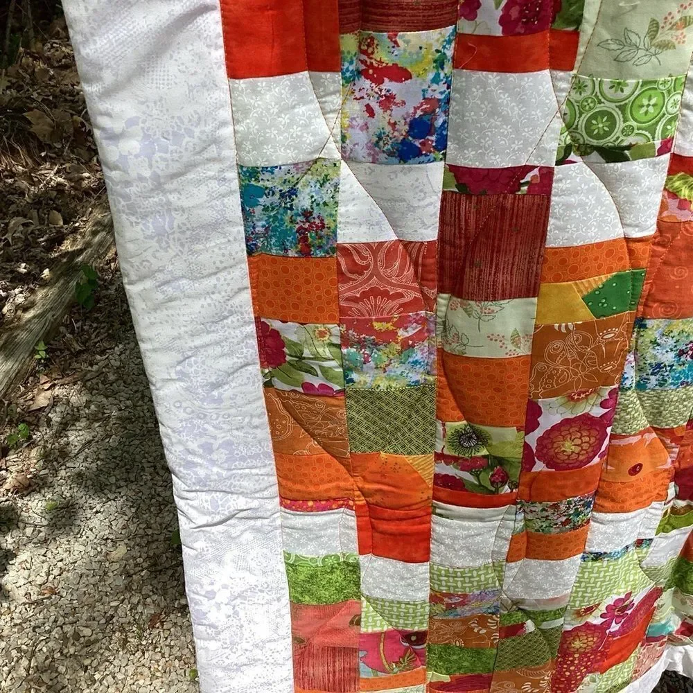 New With Tags.  Bright Summer Orange and Green Garden Coin Lap Quilt